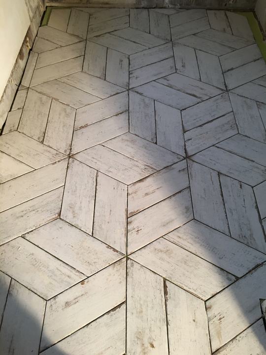 Geometric patterned floor tiles