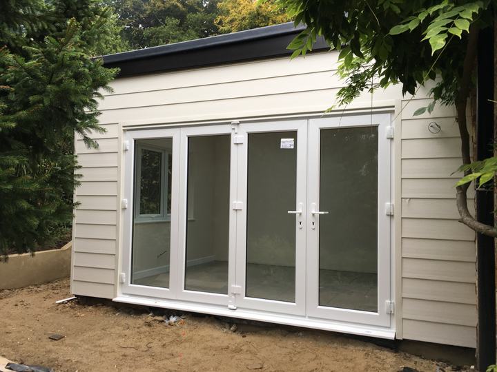 Clad garden office with bi-fold doors