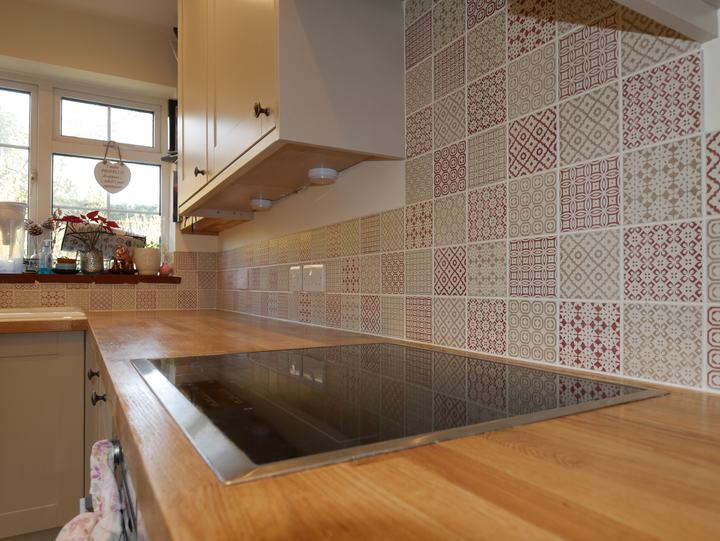 Kitchen with oak worktop and patterned tiled splashback