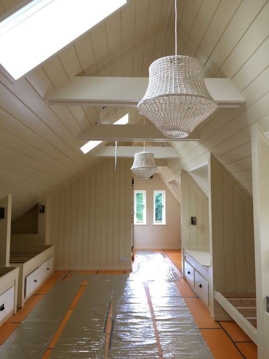 Freshly decorated loft room with panelled walls